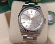 Rolex OP 34mm Silver de 2023, full set en très bon état